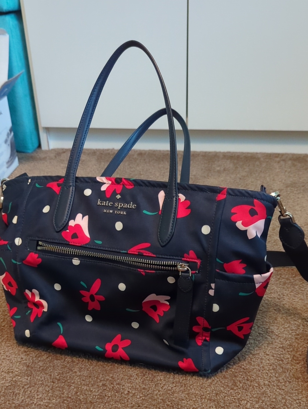kate spade navy floral tote with red and pink accents